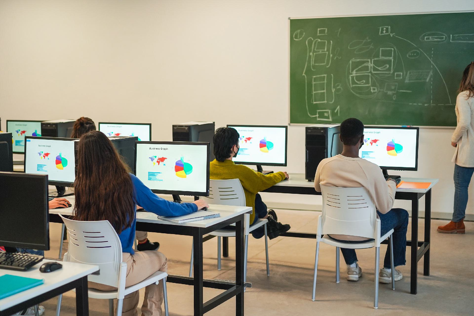 A trainer at a small Australian RTO reviewing AI-drafted course material before it goes to learners