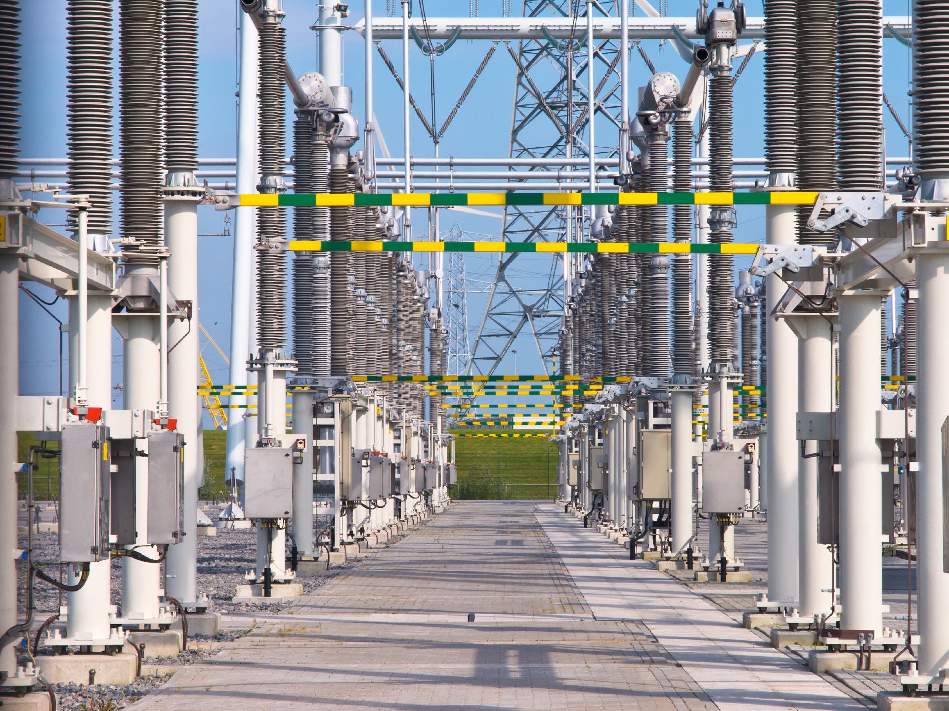 A regional utility planner reviewing a versioned load forecast against feeder telemetry