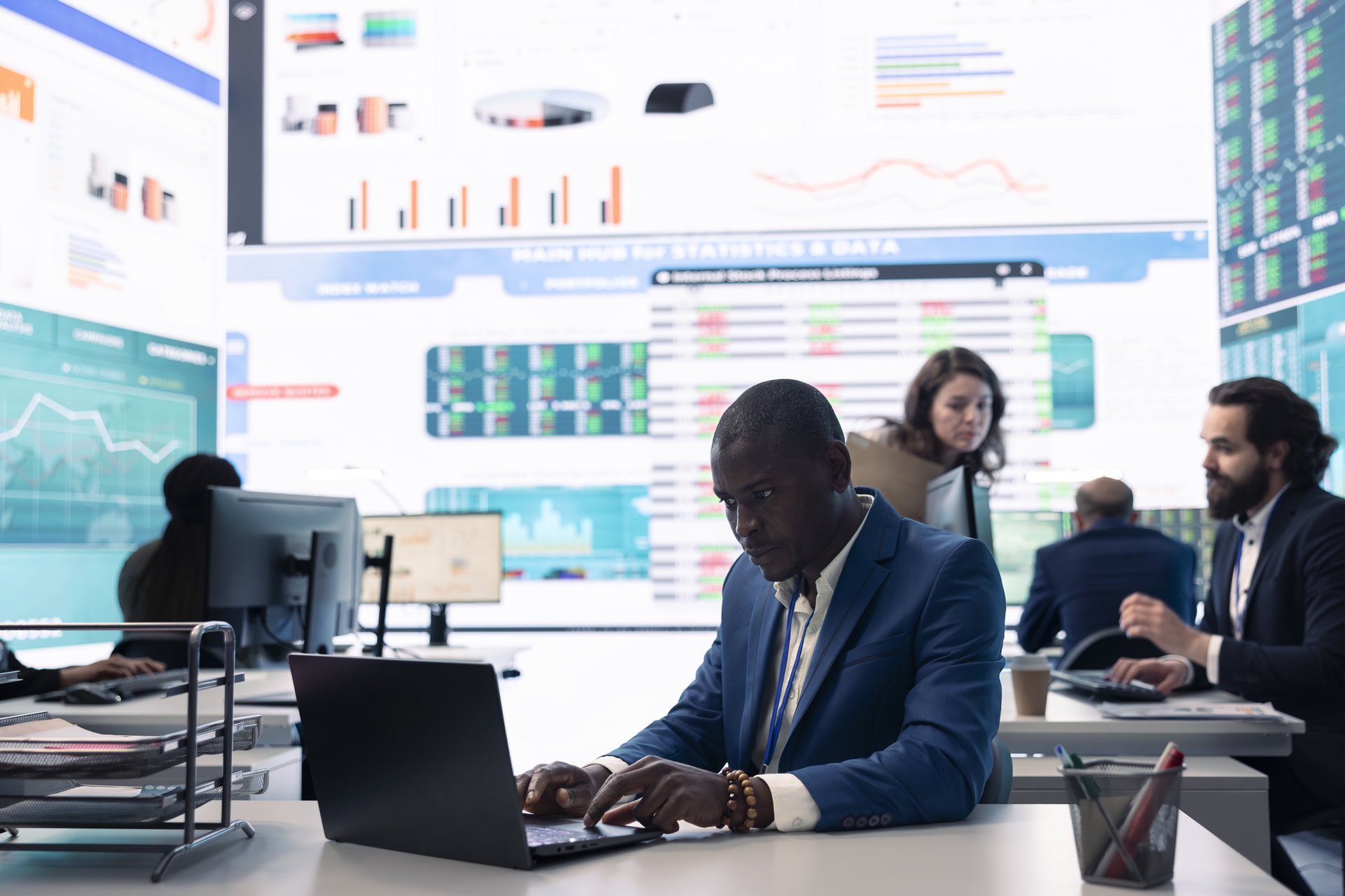 An analyst examining consumption and margin statistics on screen, the view Power BI puts in front of the team each day